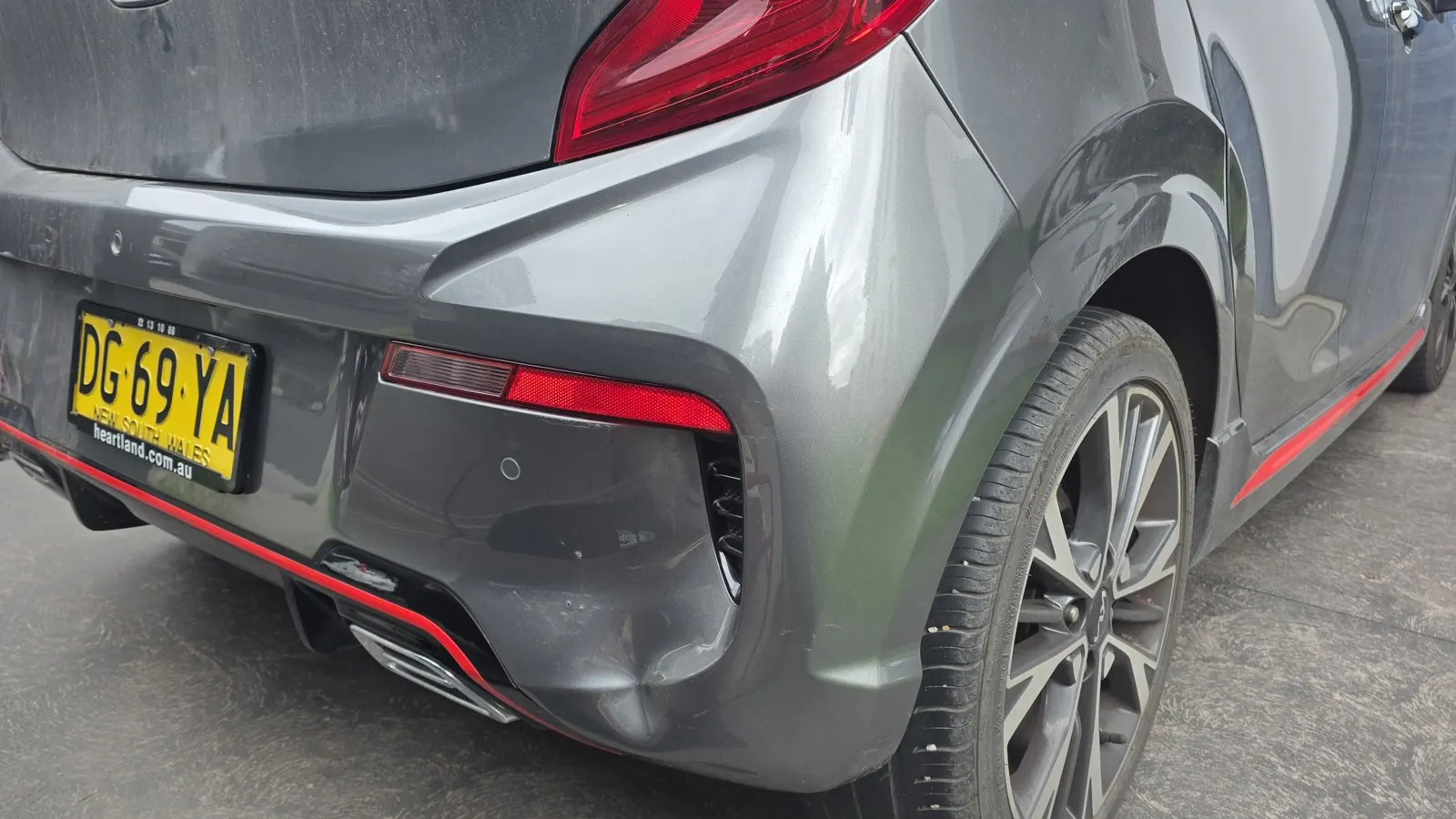 Grey car rear bumper repair before repair