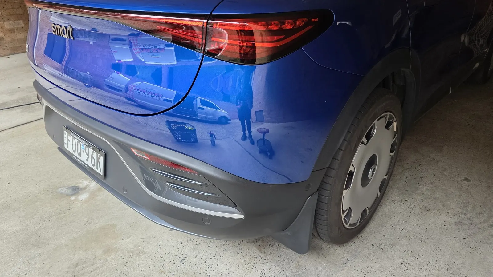 Blue car paint and panel scuffs after repair
