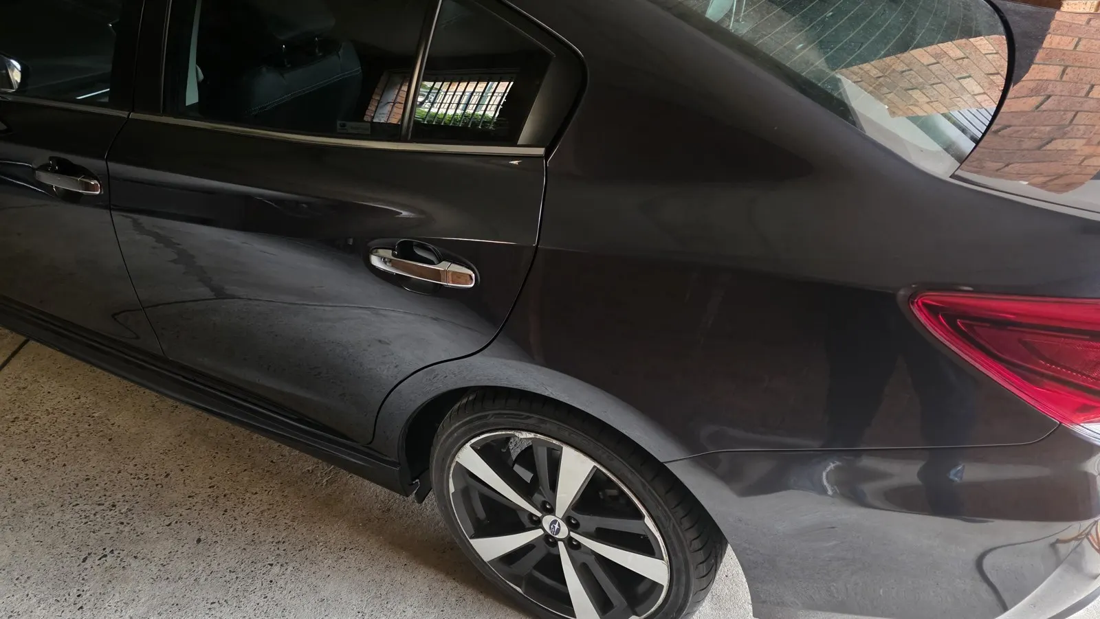 Dark car rear quarter repair after repair