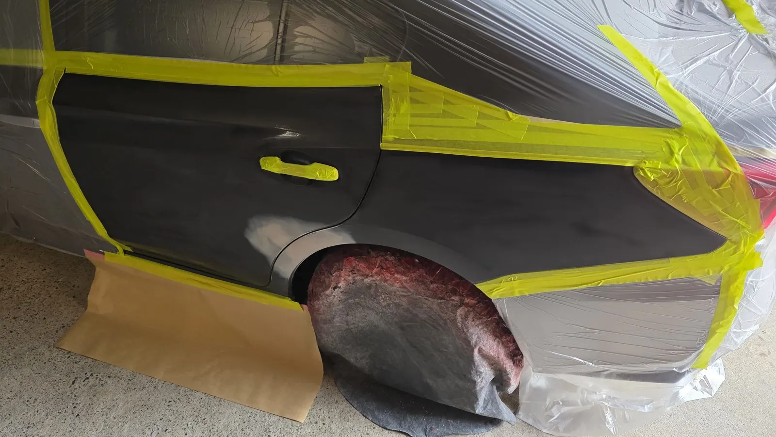 Dark car rear quarter repair before repair
