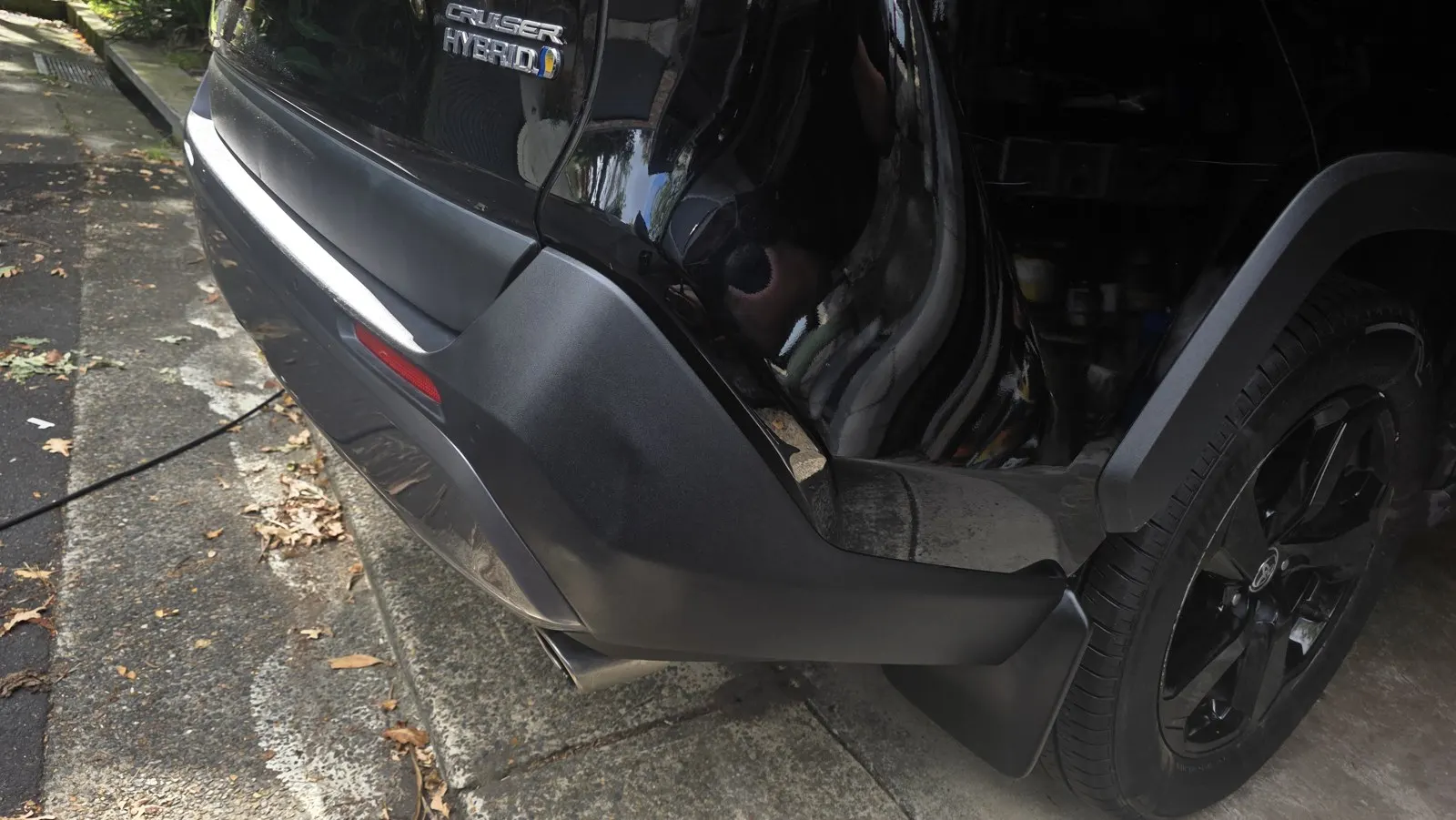 Black SUV rear bumper repair after repair